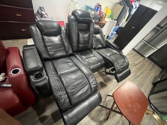 Black leather sofas in good condition