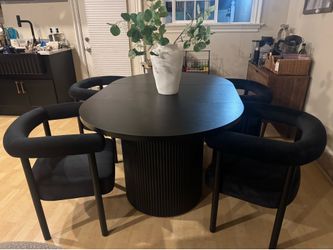 Set of black velvet dining chairs