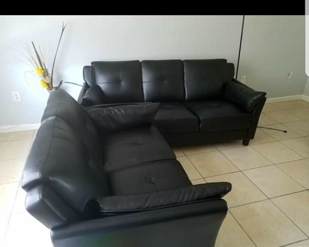 Two leather seat couches/ love seat