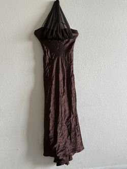 a dark brown, satin-finish halter maxi dress 