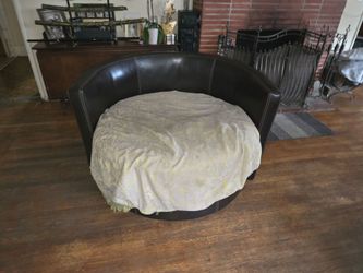 Great condition brown leather oval sofa