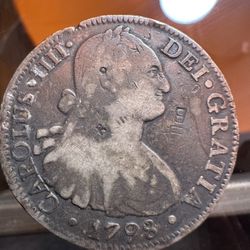 Spanish Colonial 8 Reales silver coin, specifically minted in Mexico City in 1798 under King Charles IV. 