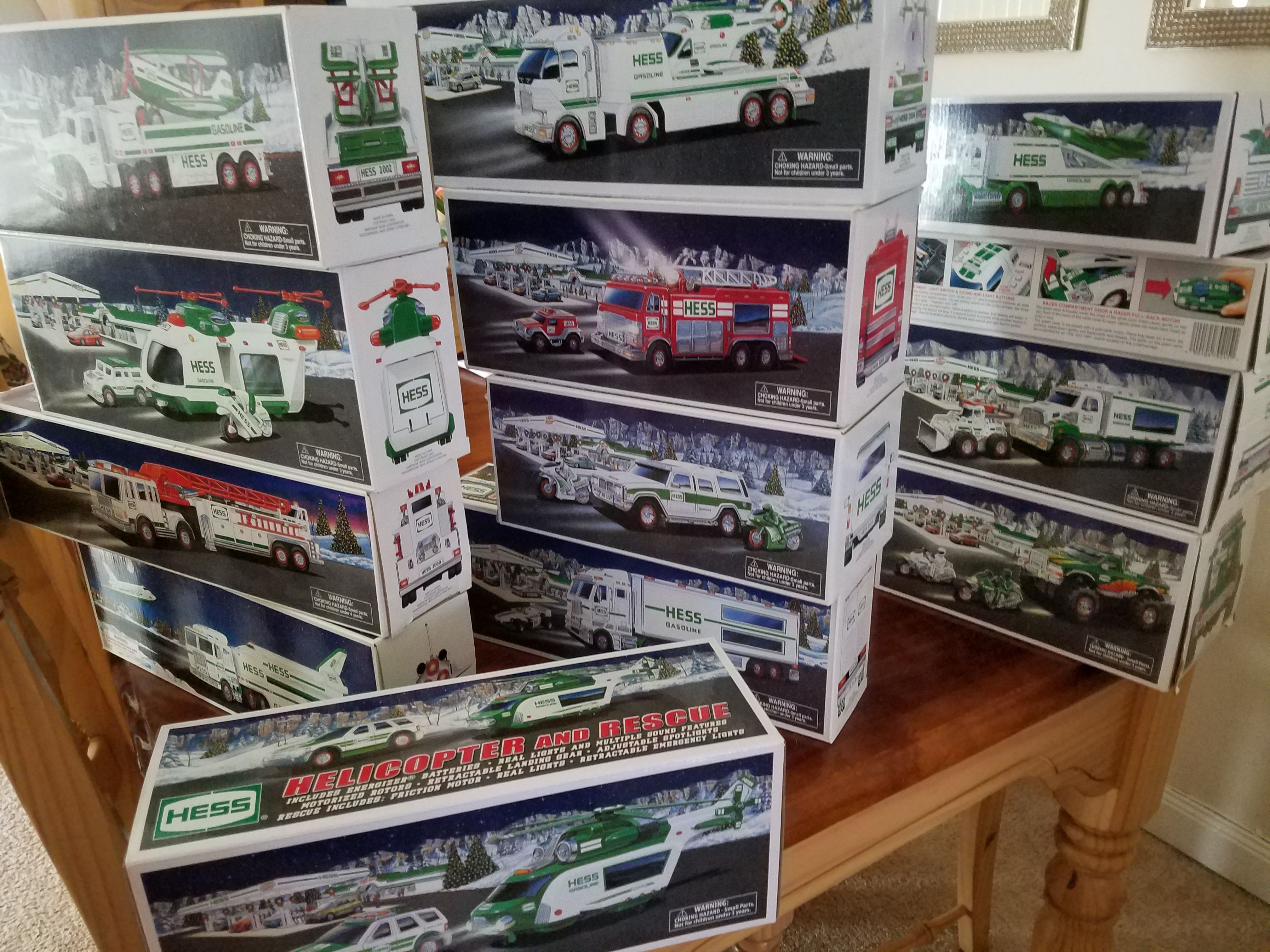 14 Hess Trucks, 1999 through 2010, 2 duplicates, most new in box. Get that special little one a Christmas present to remember. $110