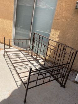 Metal twin bed with trundle-$40-Higley and ray.