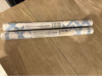 Brand new 2 packages of peel and stick  wallpaper each roll covers 3ft  5”x 8 ft times 2