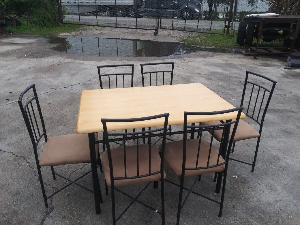 Table and (7) chairs