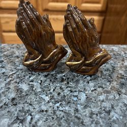 Vintage Redware Praying Hands pair of salt and pepper shakers.  Size 3 1/2 inches tall.  Preowned one cork stopper is missing.  