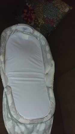 Snuggle nest portable infant sleeper