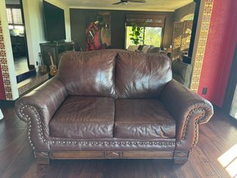Dark brown leather couch Great condition. Extremely comfortable. 57” L x 38” W x 39” H.