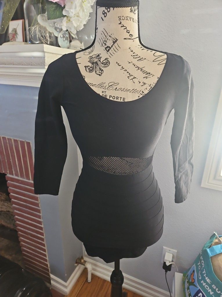 Bebe Black dress with fishnet back and front waist