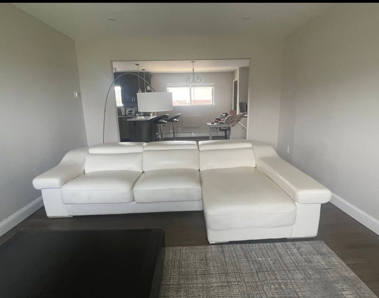 White leather sectional with adjustable headrest