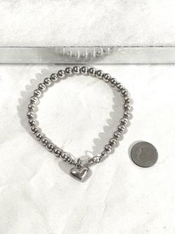 Brand new made in Italy .925 silver bead strand bracelet with silver heart pendant. 8”