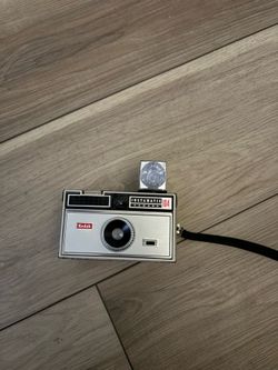 vintage 1960's Kodak Instamatic 104 camera in silver.