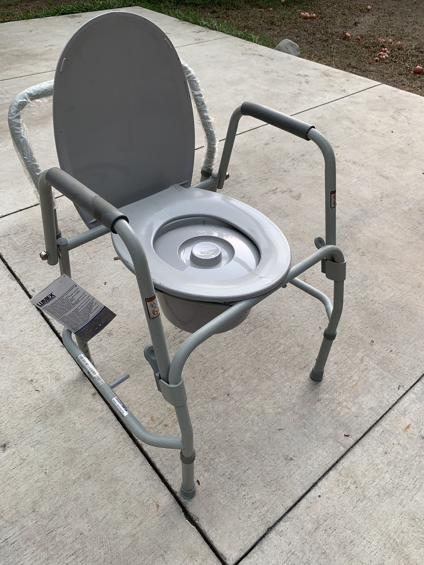 Bed side toilet seat for handicap or disabled person