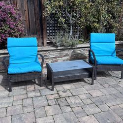 Two outdoor chairs and cushions + table