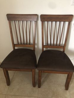 Ashley furniture brown paddled chairs