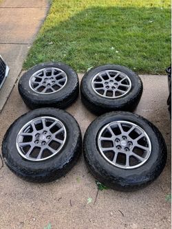 Jeep Wheel/Tire Set only couple thousand miles on the tires and they were taken off. 5x127 255/70/18 Bridgestone Dueler Tires