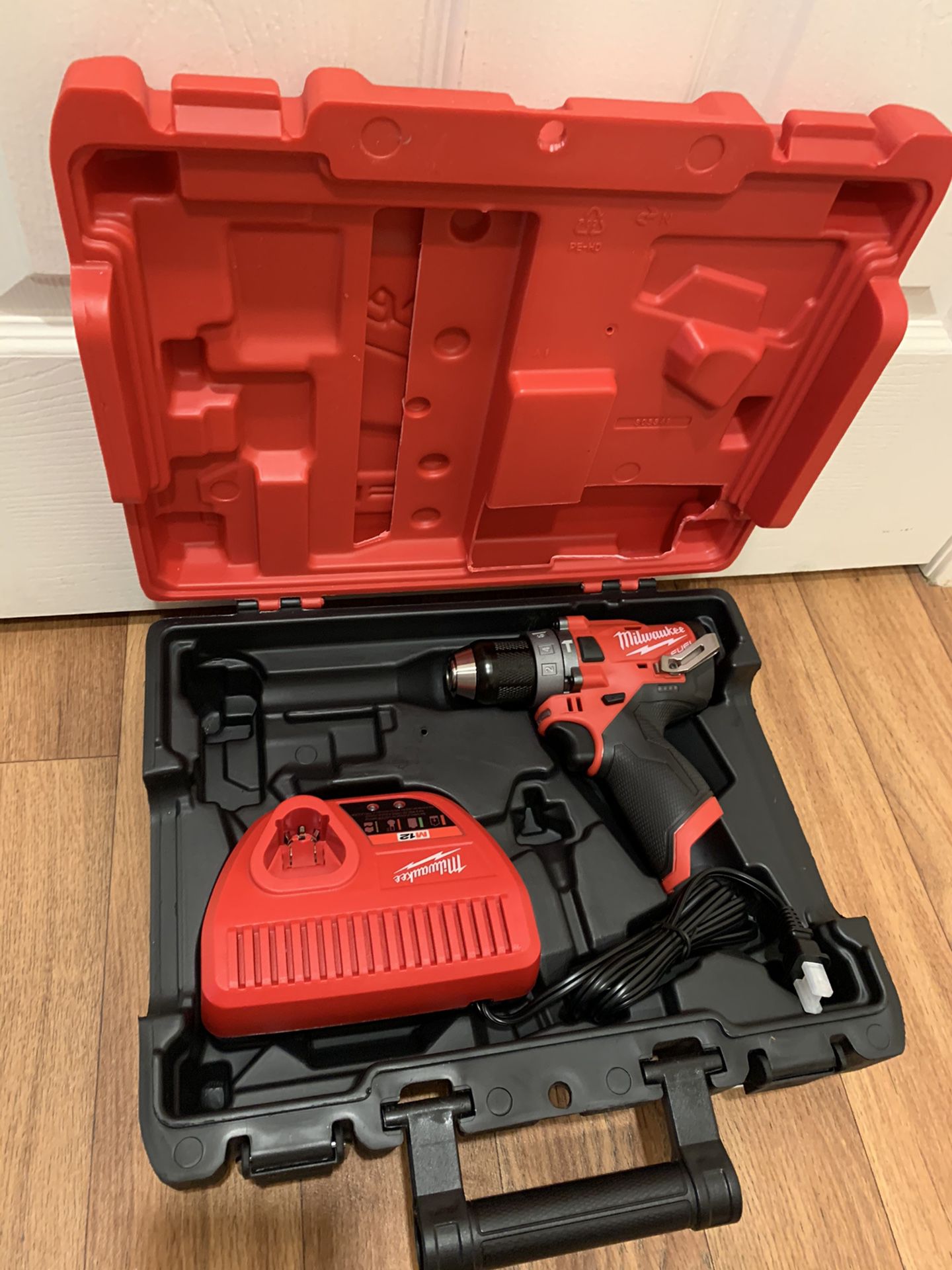 Milwaukee m12 drill with charger and hard case. $100 price is firm
