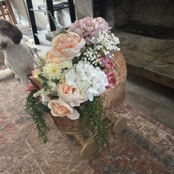 Wicker Baby Carriage With Floral Arrangement 