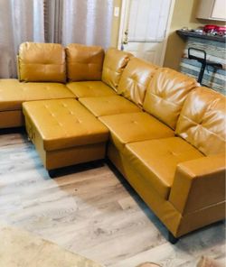 Beautiful Leather Sectional with compartment ottoman