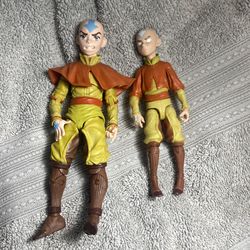 Avatar: The Last Airbender" Aang action figures from McFarlane Toys, likely a 7-inch scale figure and a smaller 5-inch version