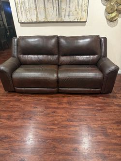 Brown leather love seat and 3 seater couch
