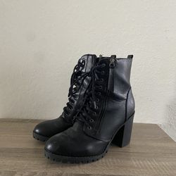 Black heeled lace-up combat boots 