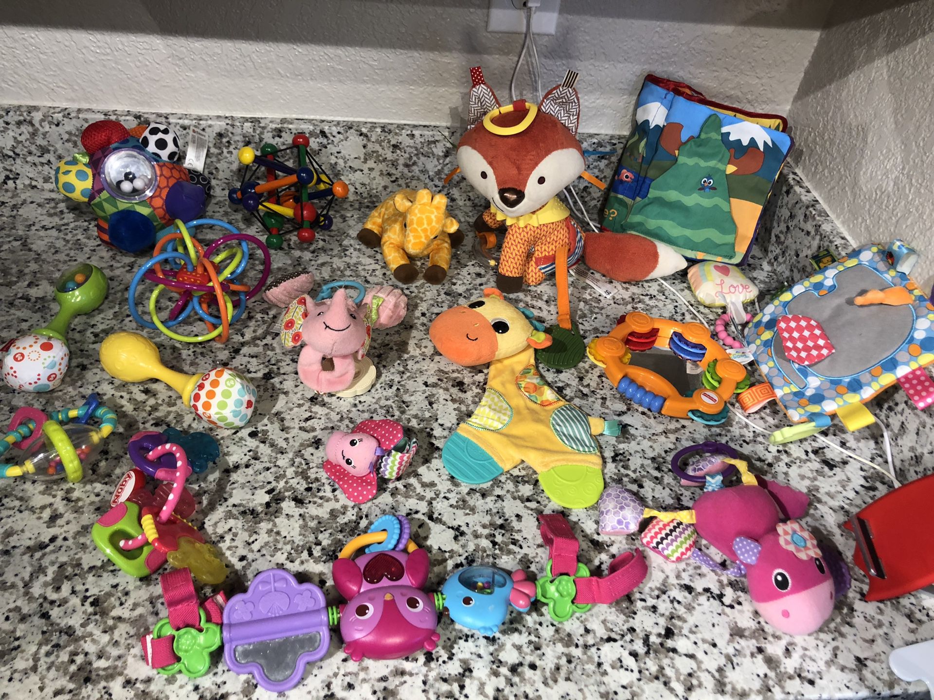 Variety of infant and baby toys. Stroller toy as well