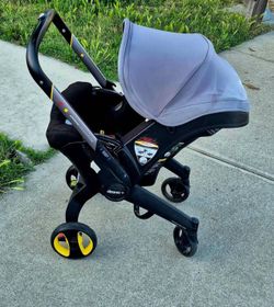 Doona car seat stroller with base and bag