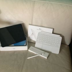 Apple iPad 10th Gen, Apple Pencil 2nd Edition, And Apple Magic Keyboard Folio. 
