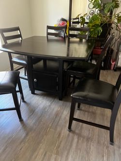 Dark wood dining table and chairs