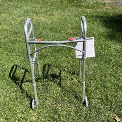 NEW WITH TAGS. FOLDING WALKER. DRIVE MEDICAL