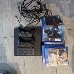 PlayStation 4 with 2 Controllers + Games – Great Condition