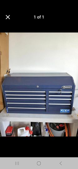 Navy blue Kobalt tool chest features 12 drawers for organized storage.