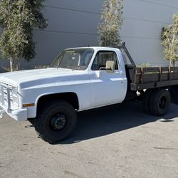 1986 CUCV 1 Ton 4x4 Dually Flat Bed .