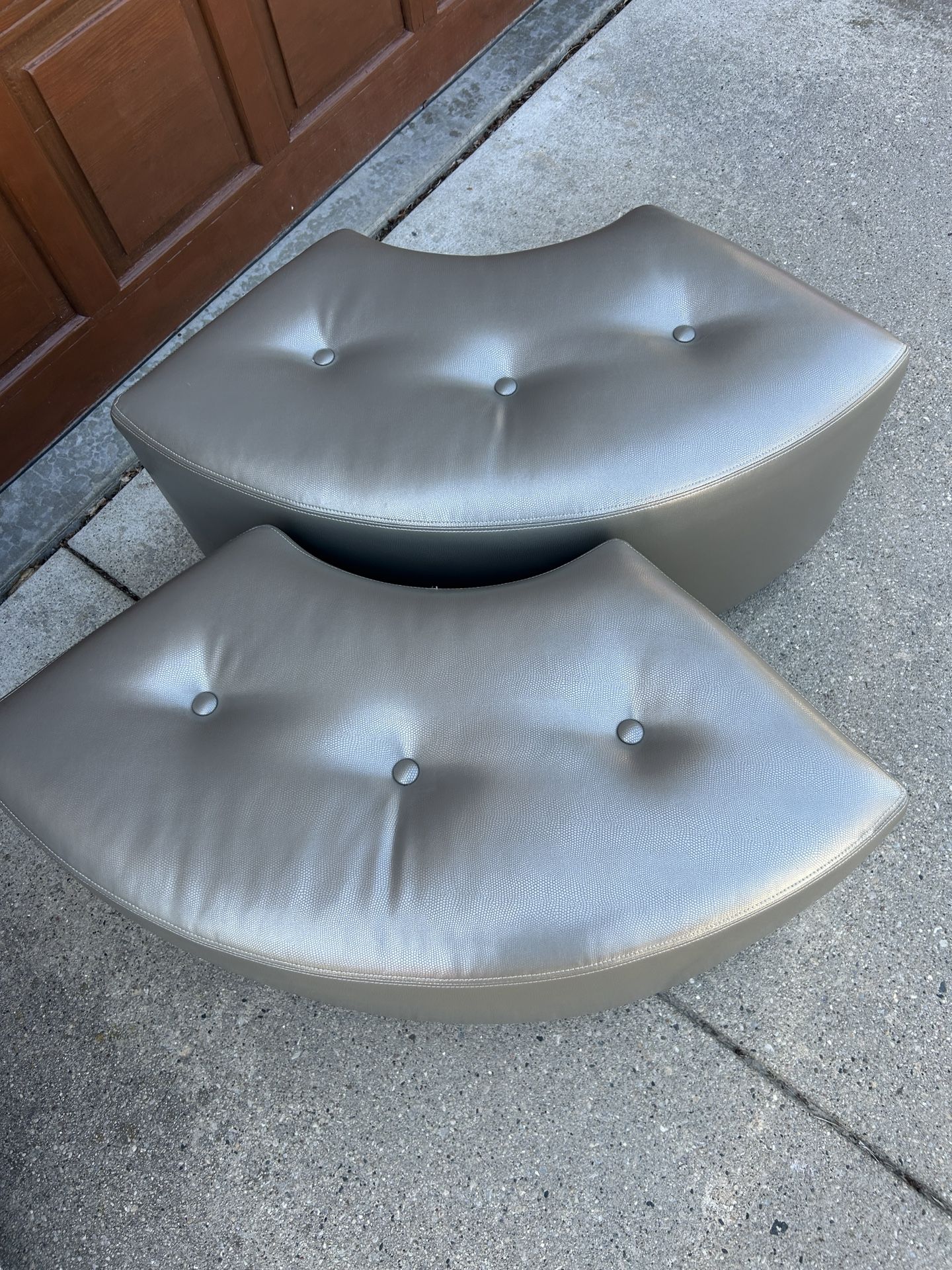 Two Matching Silver Ottomans