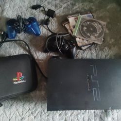 Playstation 2 with Games And Controllers