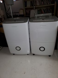 Two identical 70 pint Frigidaire dehumidifiers