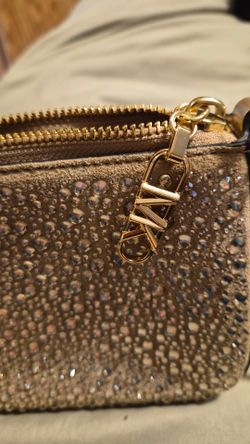 MK gold, small clutch purse.
