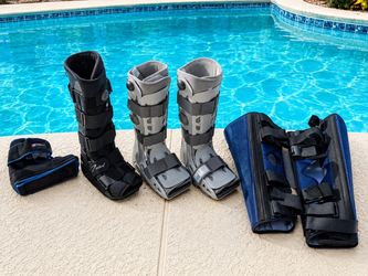 Lot of Medical Walking Boots and Leg Braces
