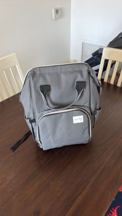 Medical Breast Pump Backpack, featuring a water-resistant design with dual top carrying handles and a front organizer pocket