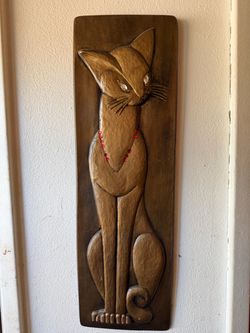 CAT PICTURE, gold 7 1/2"w x 23"tall; cross streets are Arapaho & Waterview