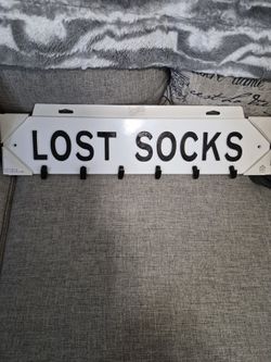 Washroom plaque lost socks