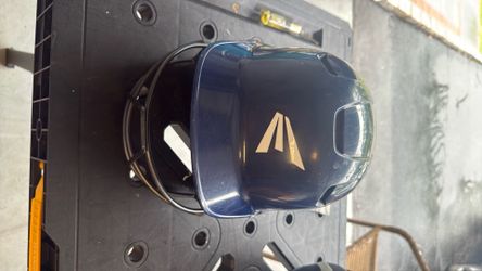 Blue Easton Boys baseball helmet with metal gaurd