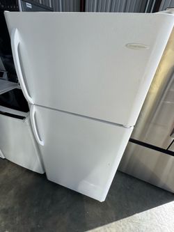 Frigidaire refrigerator top bottom door 18 cu.ft  dimensions 66 1/2 height 29  width  30 depth works perfectly extra for delivery same day delivery an