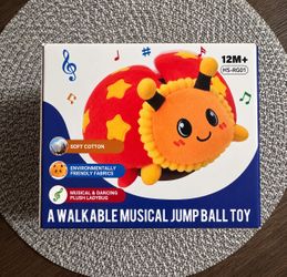 Musical jump ball toy