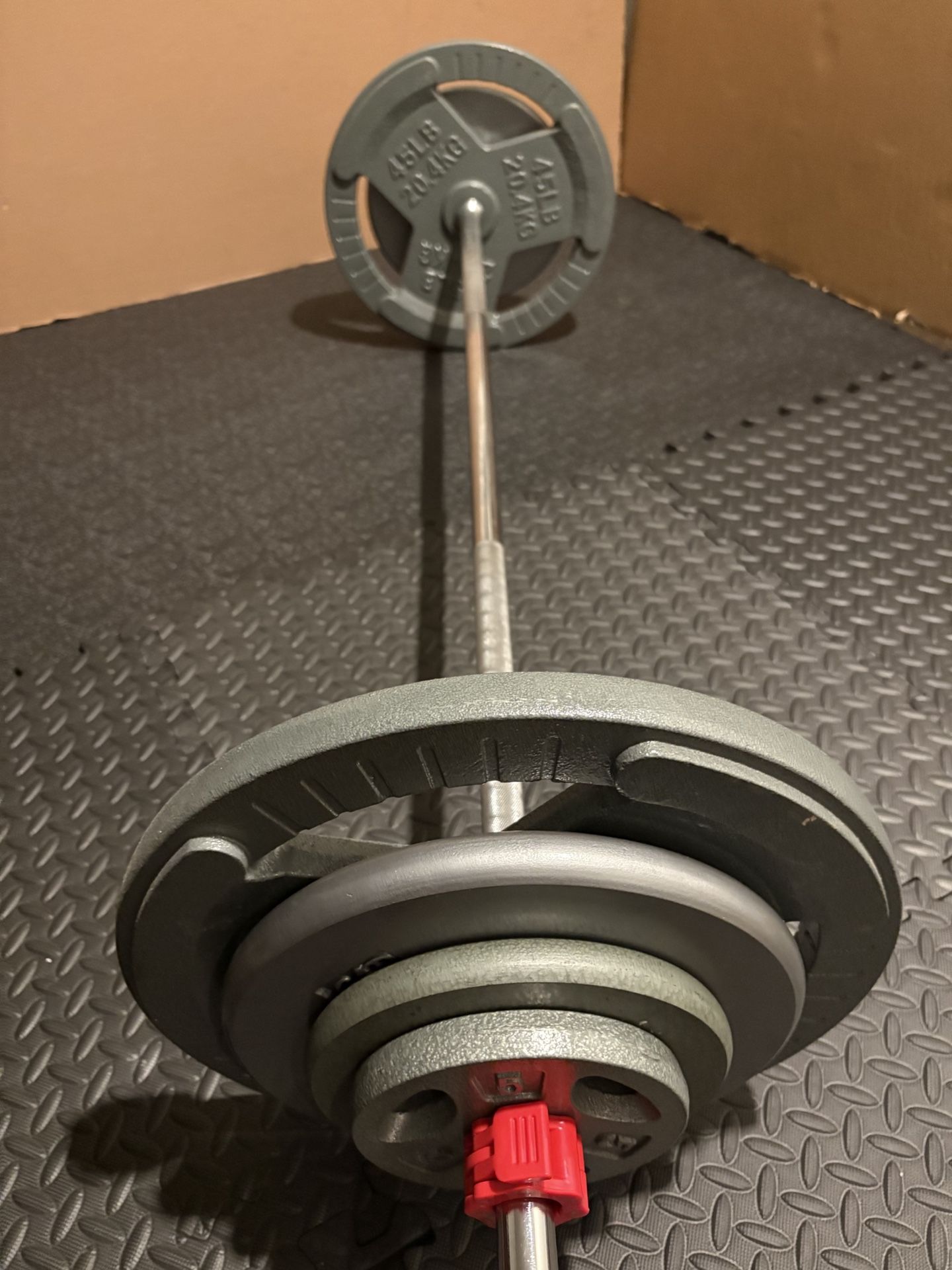 BRAND NEW Standard: 6 ft Steel Barbell with pairs of 45s 25s 10s and 5s. Total: 190 lbs