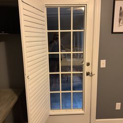 Door with plantation shutters