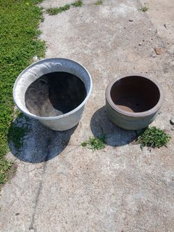 Flowerpots: One is plastic and the other is ceramic.$10 for both  Used.