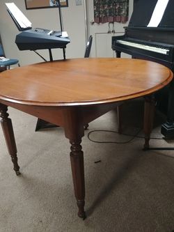 Antique round table on wheels
